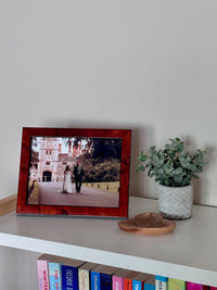 Arty Originals Signature Collection photo frame displaying a wedding picture, decorated with greenery and a wooden dish.