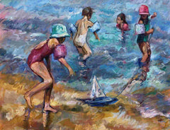 Children on beach with toy boat